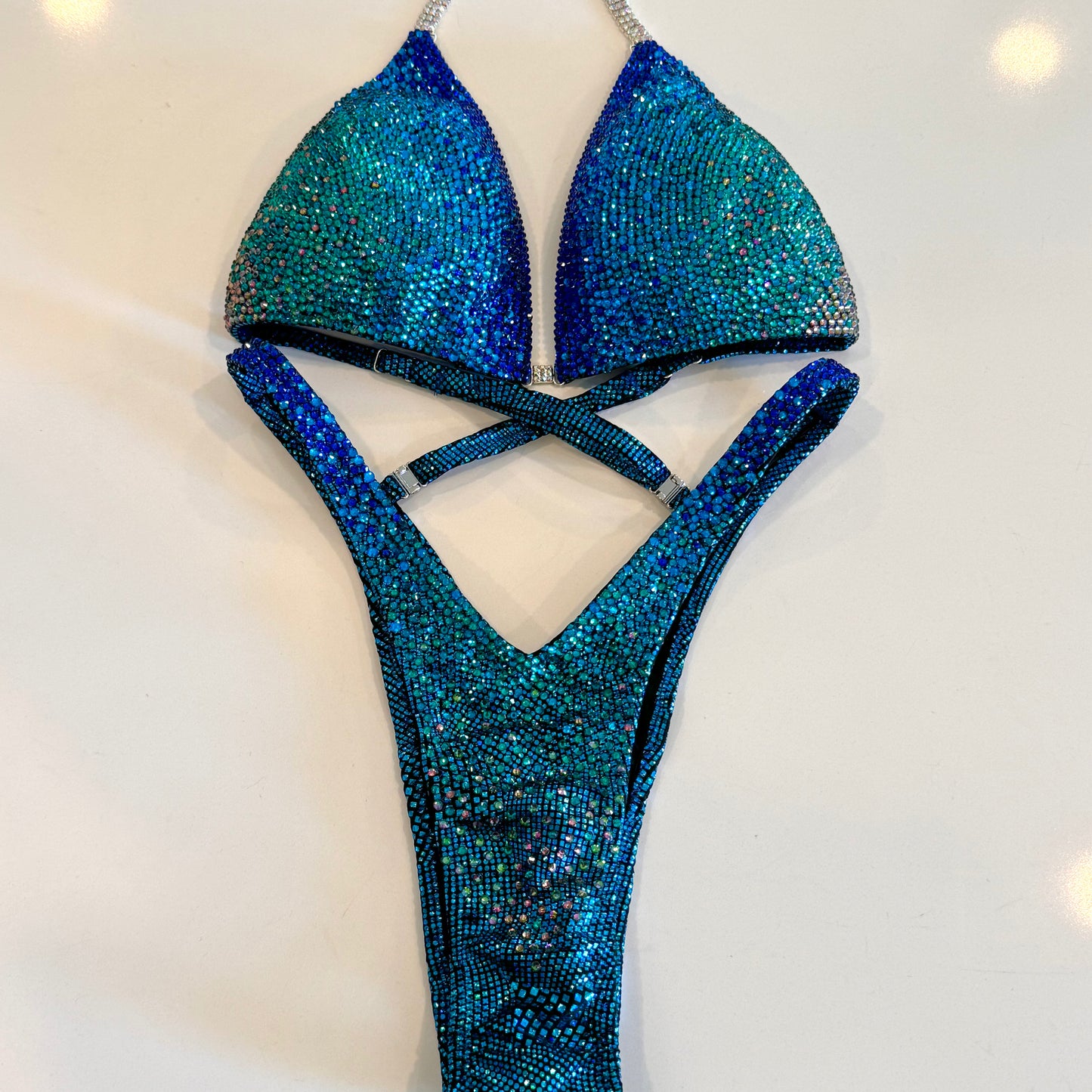 Royal blue to teal Ombré, solid stoned competition Figure suit.  NPC Denver, Colorado