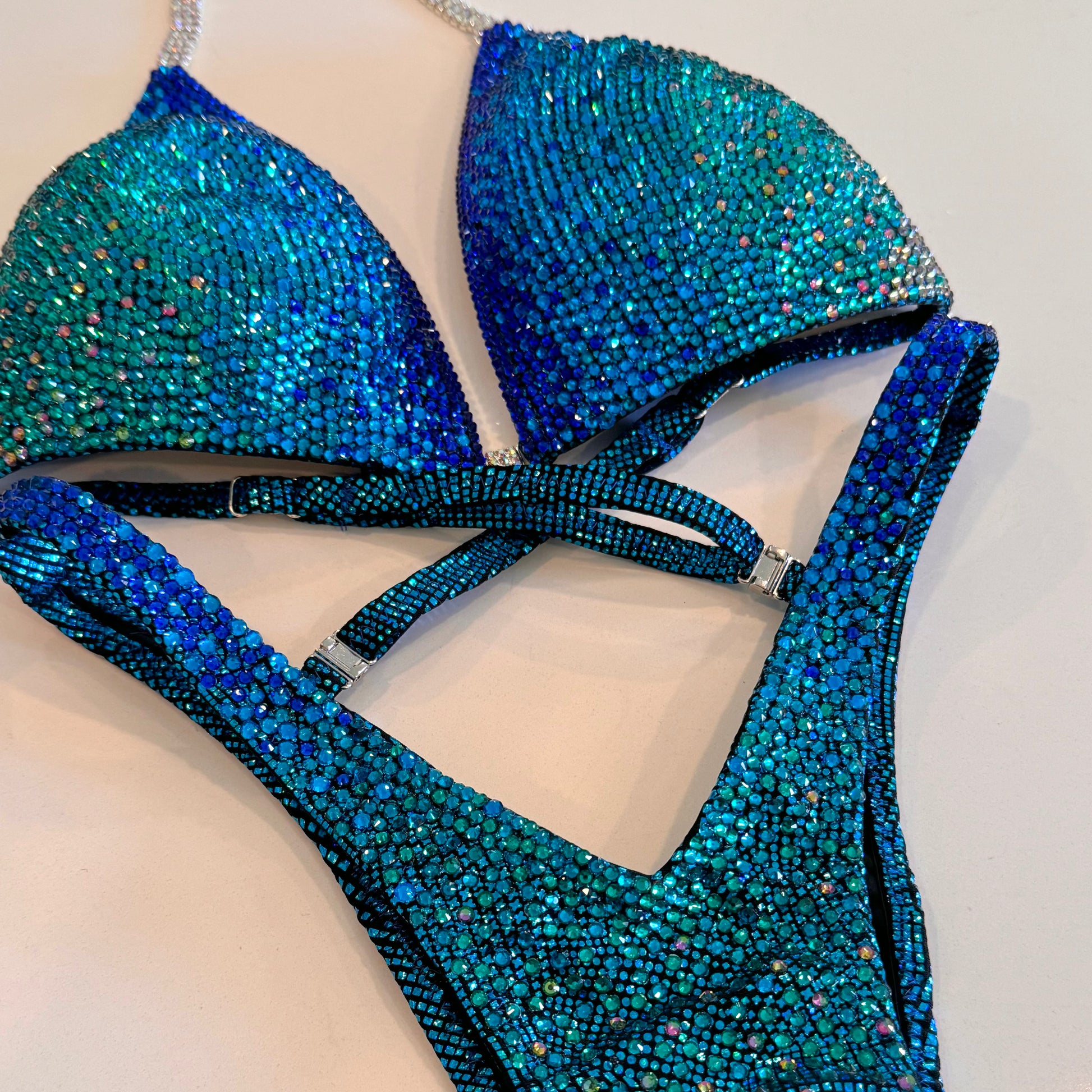 Royal blue to teal Ombré, solid stoned competition Figure suit.  NPC Denver, Colorado