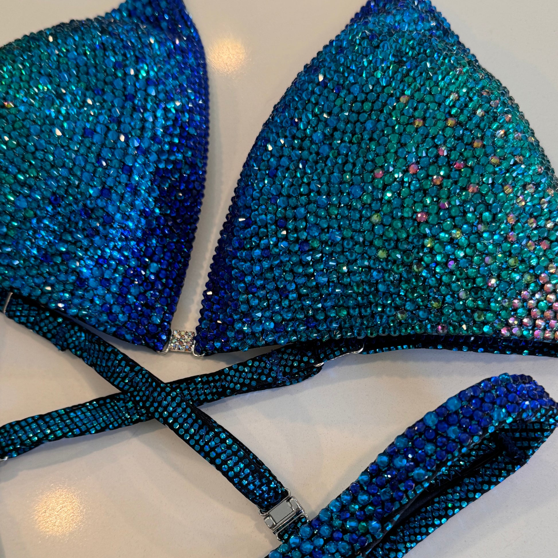 Royal blue to teal Ombré, solid stoned competition Figure suit.  NPC Denver, Colorado